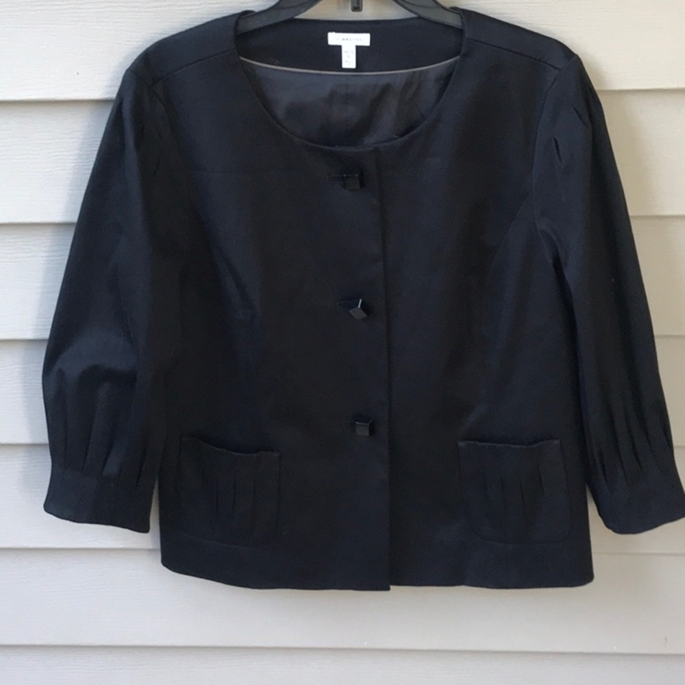 Unique detail on this pretty black jacket. Size XL